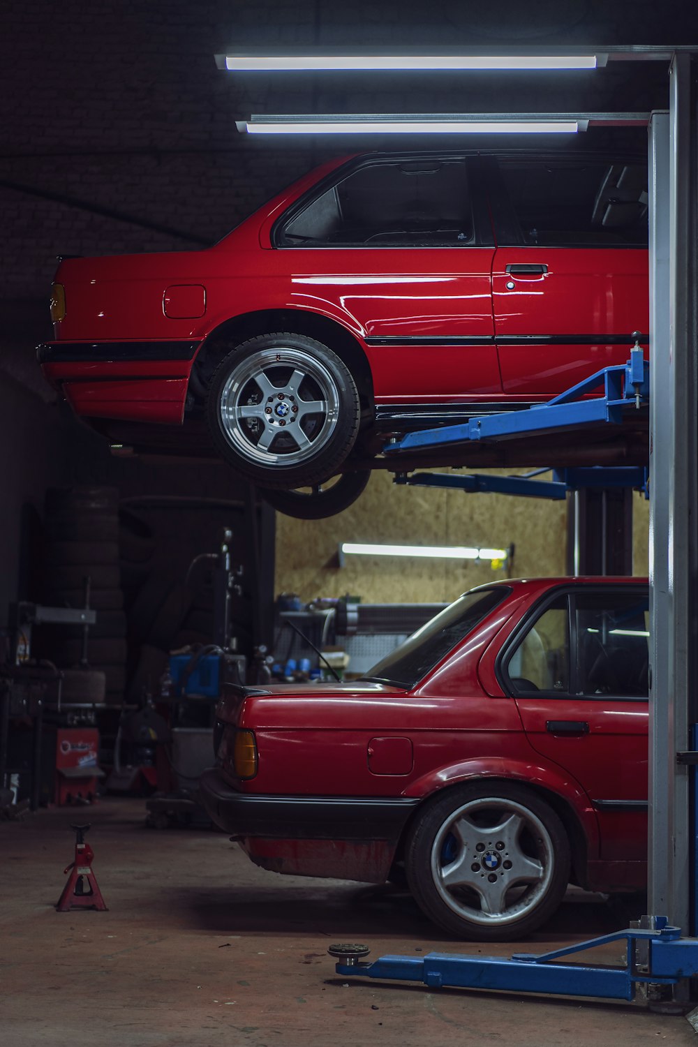 A car raised on a lift in a repair shop